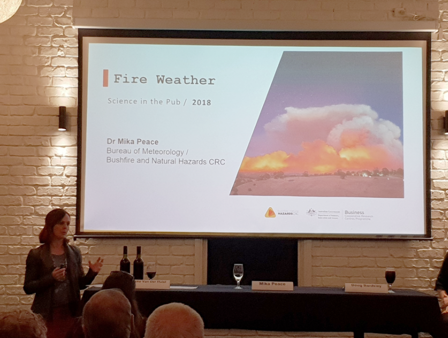 Dr Mika Peace presents her fire research at a pub in Adelaide.